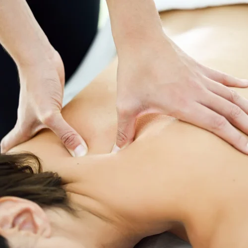 young-woman-receiving-back-massage-spa-center (1)